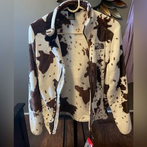 The north face cow print jacket size small. New with tags